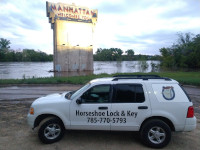 Locksmith Vehicle in front of City Of Manhattan Welcome Sign