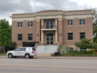 Vehicle Parked in front of Carnegie Library in Clay Center, KS