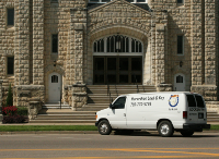 Van parked in front of Church on Poyntz Avenue in Manhattan